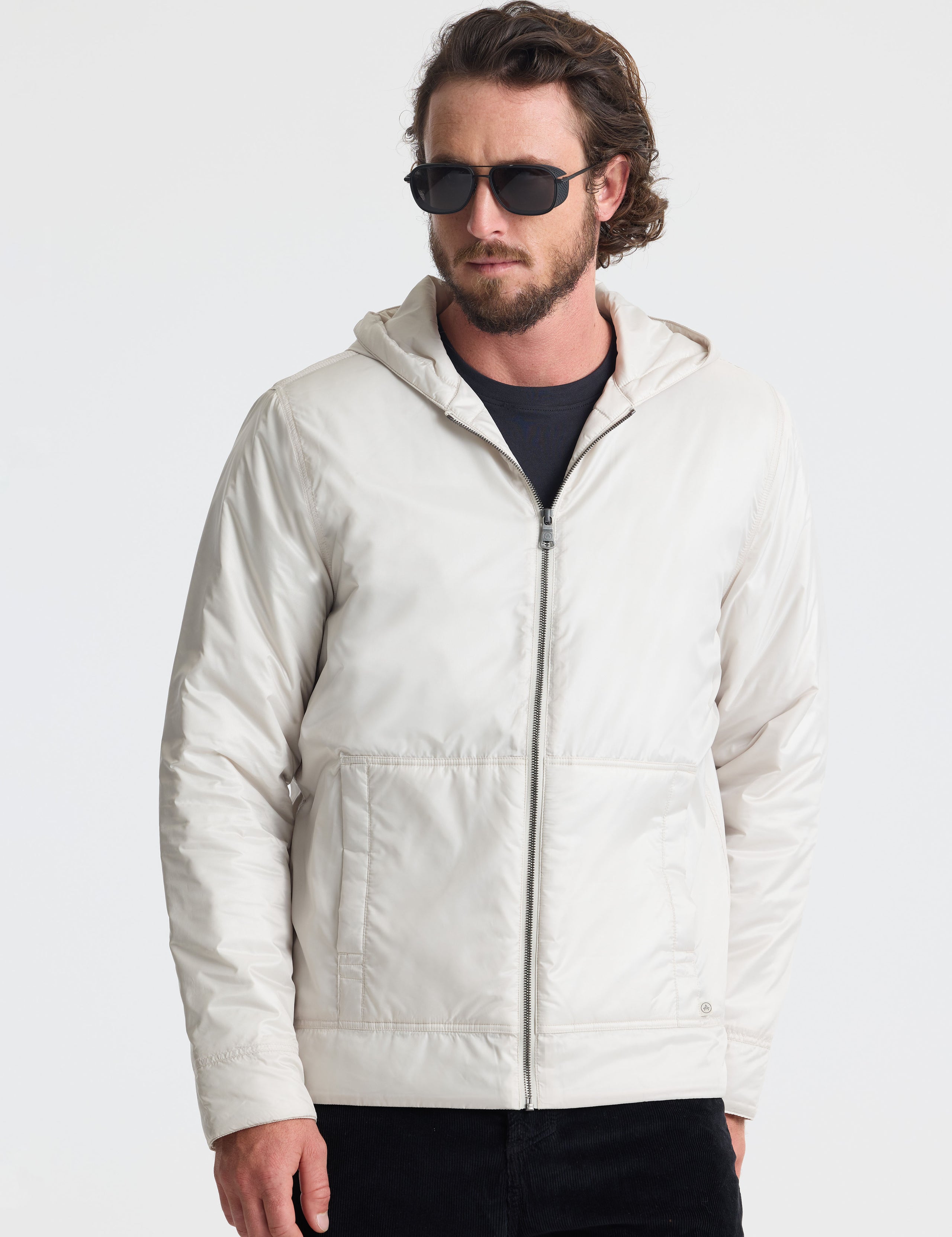 Front view of man wearing Eco Space Hoodie in Bone white from AETHER Apparel. 