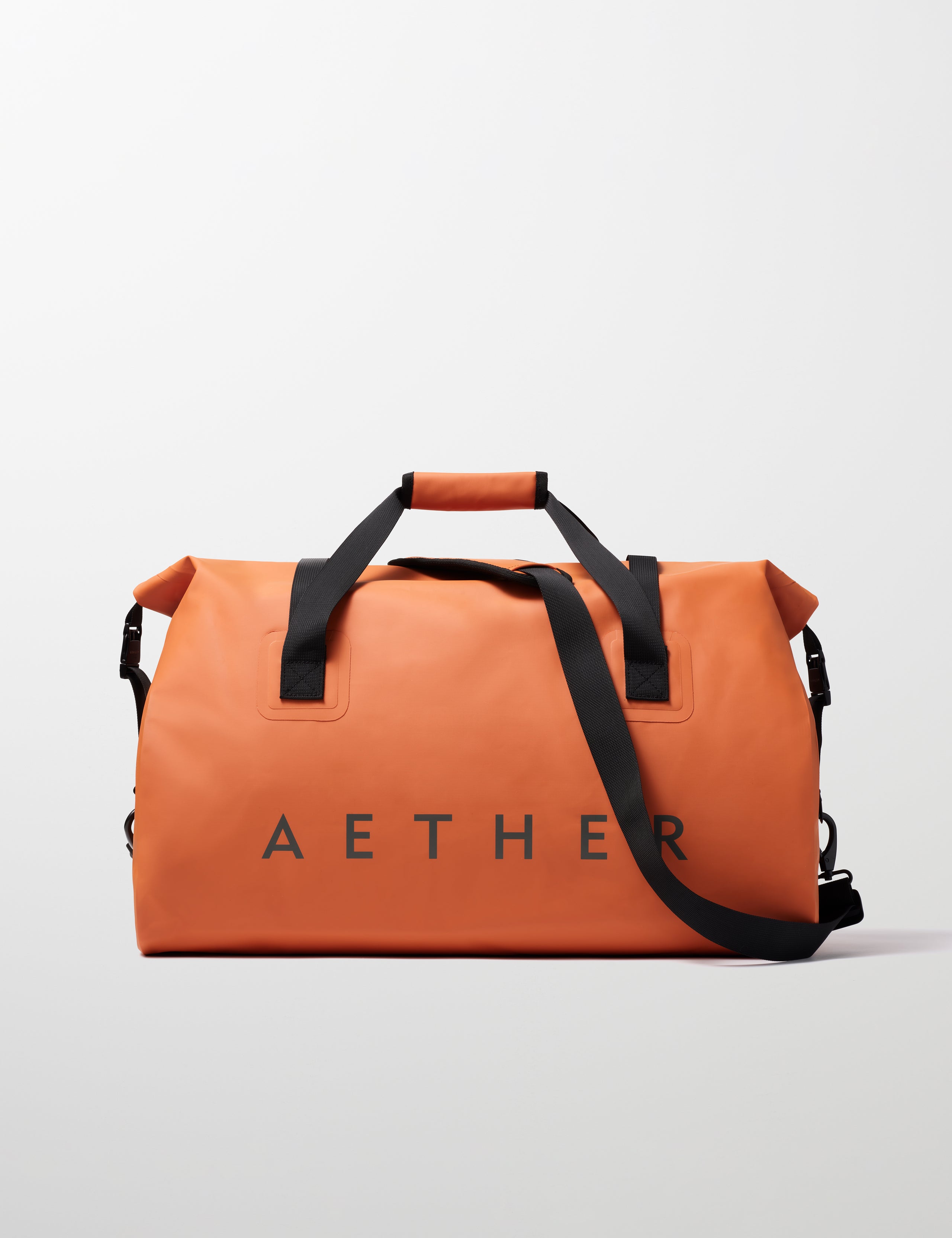 Rear view of Excursion Duffle Bag 60L in Autumn Orange from AETHER Apparel.