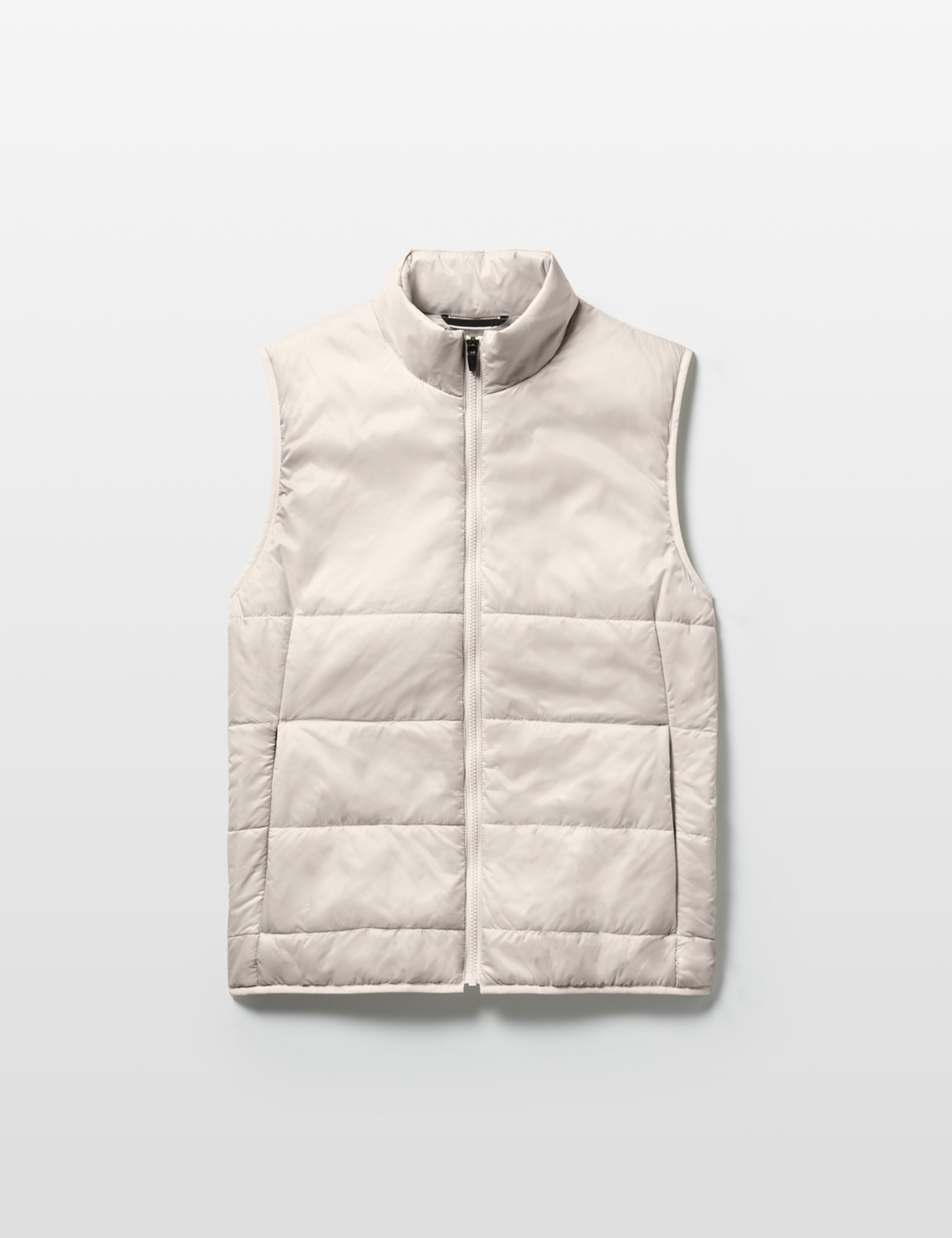 Flat lay of Eco Insulated Vest in Bone white from AETHER Apparel.