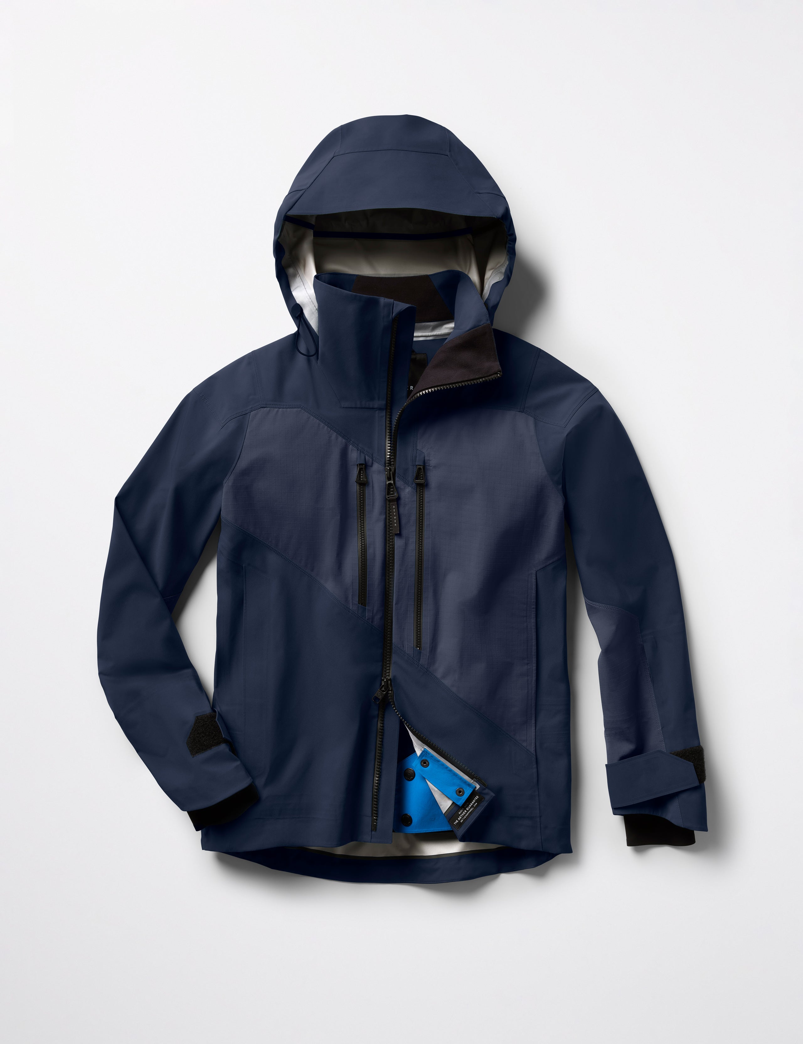 Flat lay of Maverick Snow-Shell Jacket in Total Eclipse dark blue from AETHER Apparel.