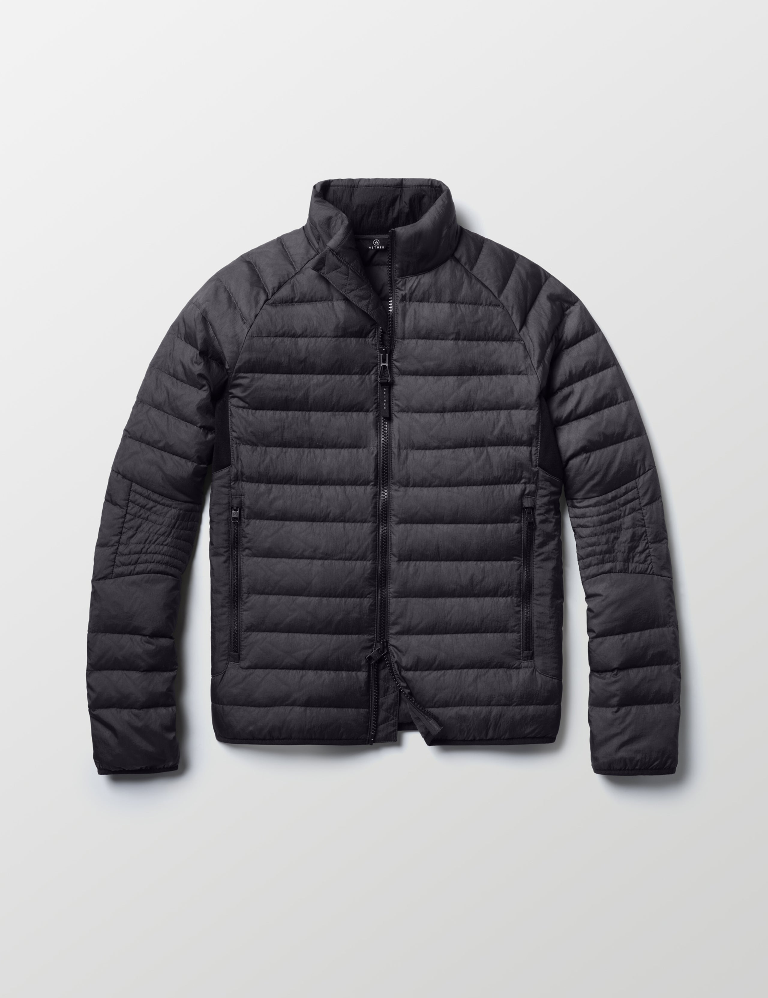 Flat lay of Prospect Packable Down Jacket in Onyx Black from AETHER Apparel.